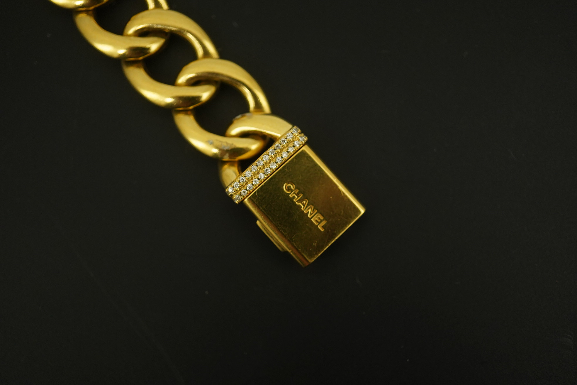 A lady's modern 18ct gold and diamond set Chanel quartz wrist watch, on an 18ct gold Chanel oval link bracelet